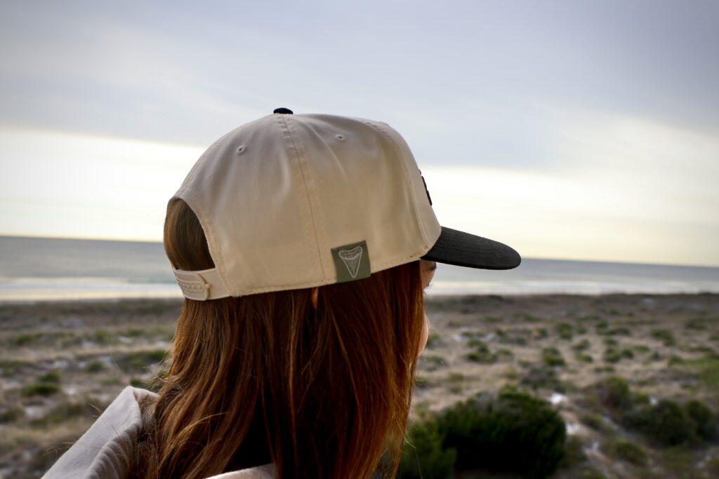 Seventh Shore Riptide Hat in natural light showing puffed Seventh Shore embroidery and 5-panel crown