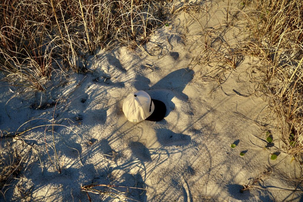 Seventh Shore Riptide Hat in natural light showing puffed Seventh Shore embroidery and 5-panel crown